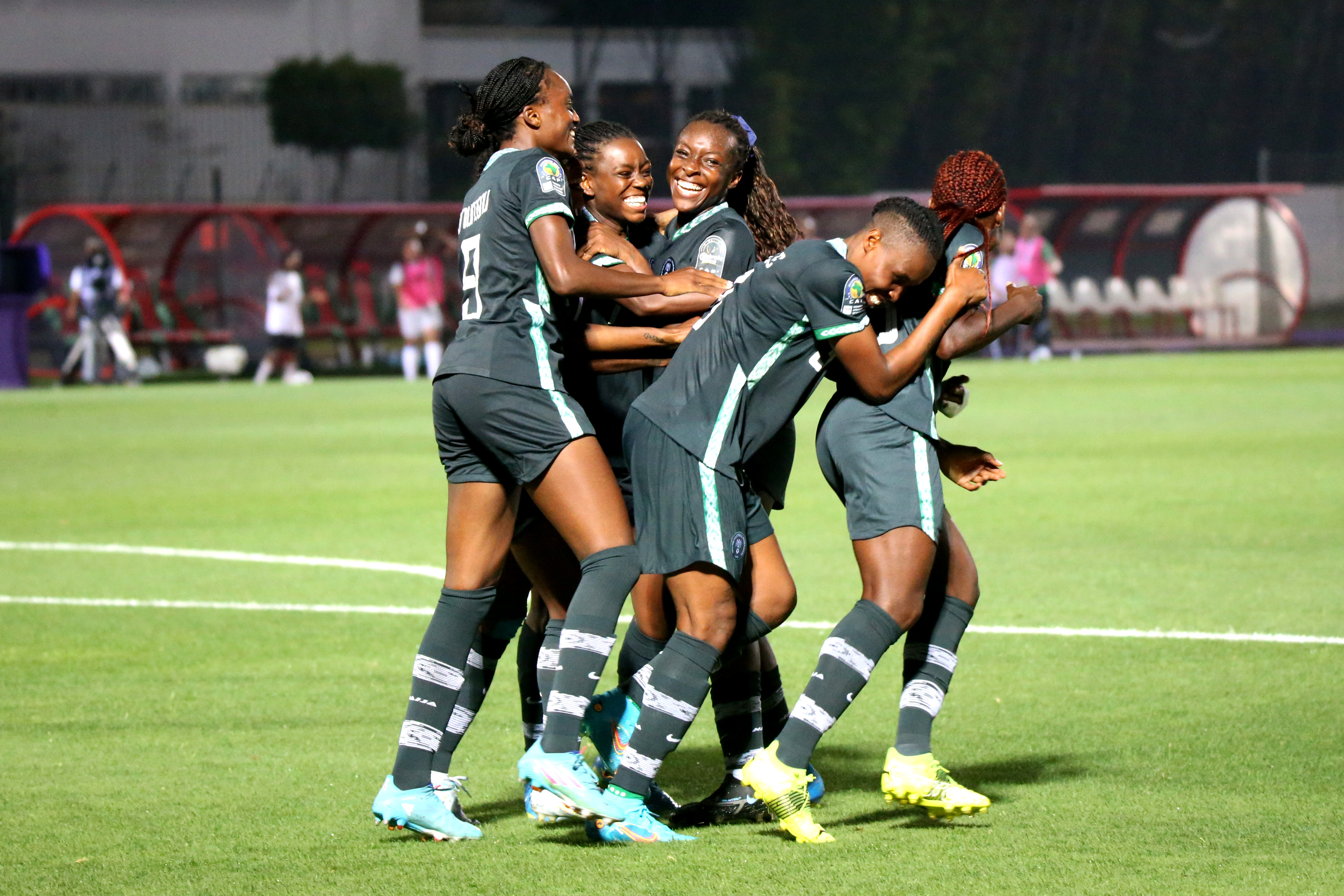 Nigeria players celebrating a goal together at the 2022 Women’s Africa Cup of Nations